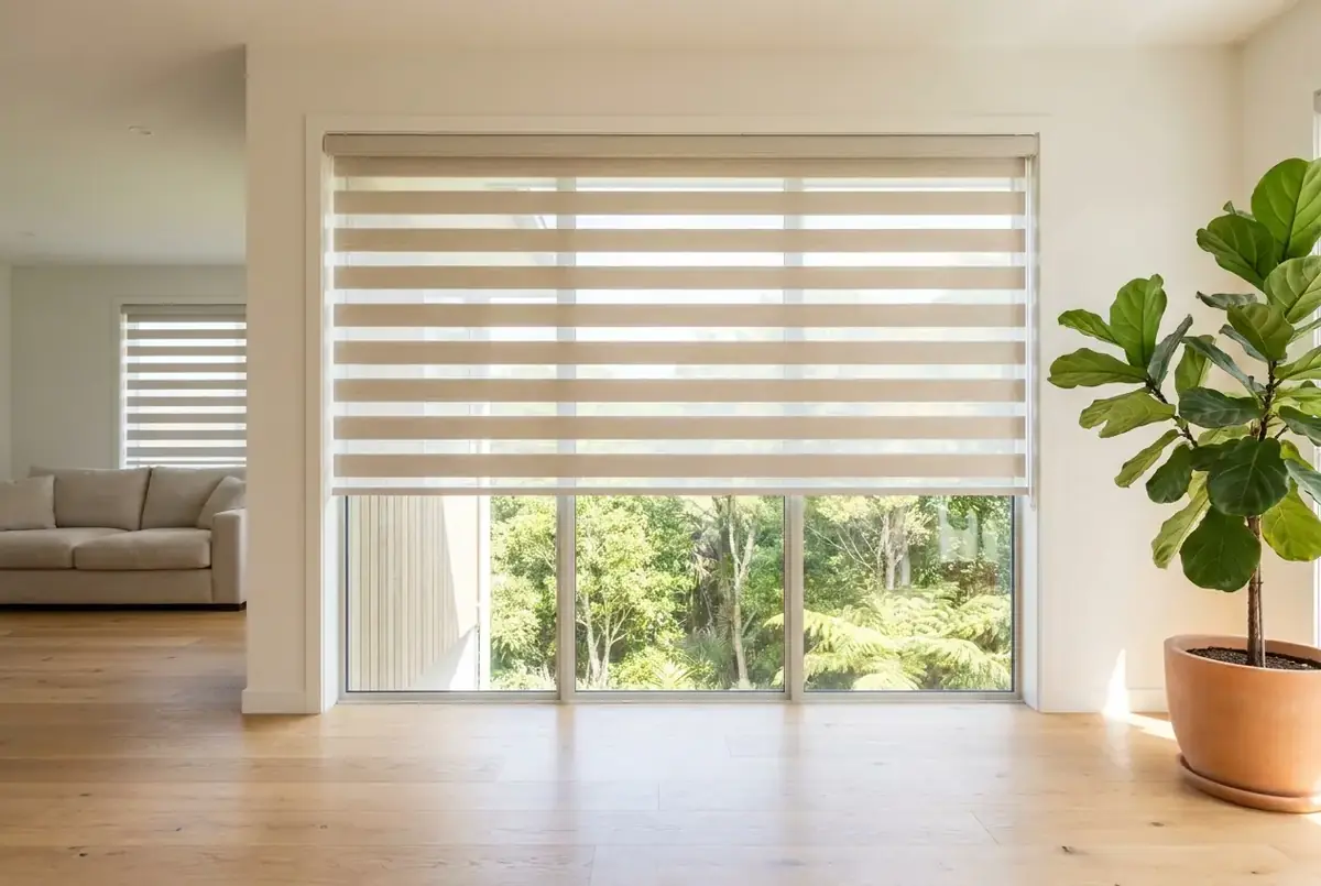 Zebra day-night roller blinds in a modern Auckland living room with sheer and blockout stripes